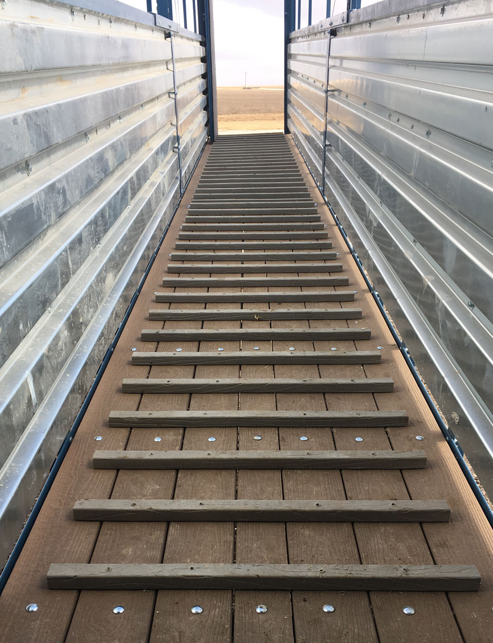Hog Slat loading chutes feature floor pickets that provide additional traction for pigs when loading at steeper angles or during inclement weather conditions.