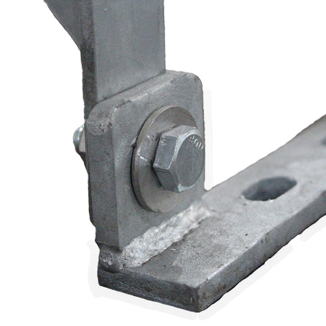 Hot-dipped galvanized floor spacing straps are secured to the barn flooring, providing a solid, pre-spaced anchor point to attach each stanchion panel.