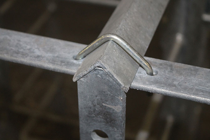 Pre-punched hot-dipped galvanized top spacer straps are secured to the top of each stanchion panel; aligning with the floor straps and resulting in correctly installed equipment that does not require any welding in the field.